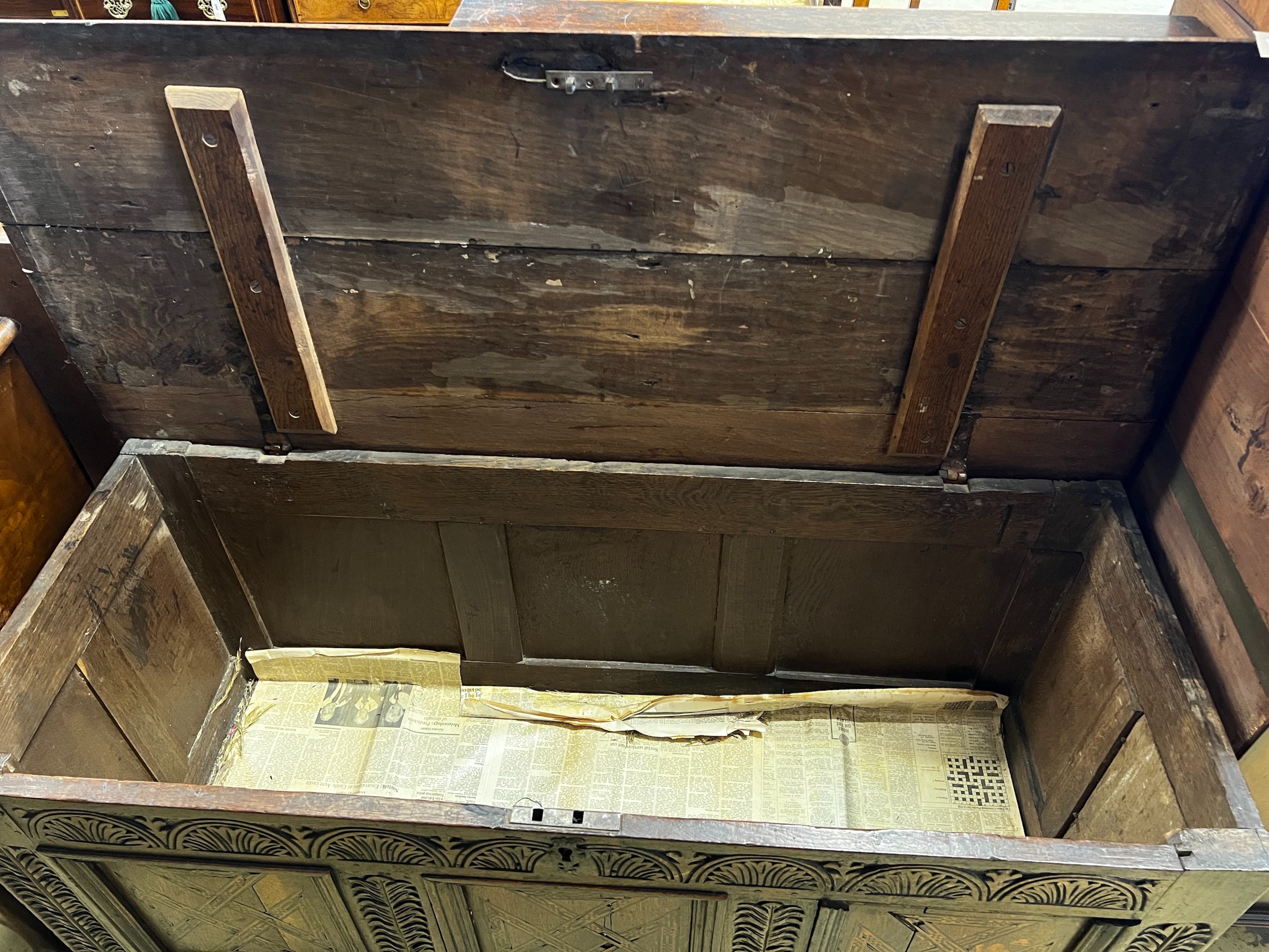 An 18th century inlaid oak coffer, length 133cm, depth 54cm, height 61cm